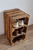 A wooden shoe rack made of stacked crates. Produktbild-Vorschau