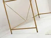 Close-up of the gold metal frame of a desk, showing the geometric support structure and legs. Anteprima dell’immagine prodotto