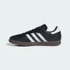 A black Adidas Samba sneaker with white stripes and a brown sole is shown against a white background. Náhled obrázku produktu