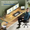A man sitting at a wooden desk with two monitors, a laptop, and a keyboard. Voir les images du produit
