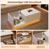 A collage of images showing a white LED coffee table with storage and a lift-top function, displayed in a living room setting and with close-ups of its features. Náhľad obrázku produktu