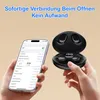 A person is holding a smartphone and a pair of wireless earbuds in their charging case. Produktbild-Vorschau