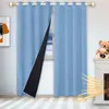 A room scene with blue curtains partially open, revealing a black quilted lining. A window with a snowy view is visible behind the curtains. A fireplace with teddy bears on top and a graphic representation of heat waves emanating from it are on the right. Produktbild-Vorschau