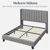 A grey upholstered bed frame with a slatted base, shown from a diagonal front-left perspective. Produktbild-Vorschau