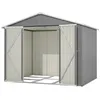 An empty metal shed with its doors open, showing the interior and the frame of the floor.