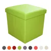 A green storage ottoman is shown against a white background. Below the ottoman are several colored circles representing different color options. Produktbild-Vorschau