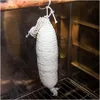 A white cheese smoking net is hanging inside a smoking chamber. Náhled obrázku produktu