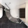 A top-down view of a modern bathroom featuring a corner shower enclosure and a toilet. Produktbild-Vorschau