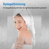 A woman with a towel wrapped around her head is winking and smiling, with a steamy mirror effect in the foreground. Produktbild-Vorschau