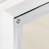 A close-up view of the corner of a window blind attached to a white window frame with a suction cup. Náhled obrázku produktu