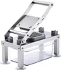 A stainless steel vegetable chopper with a clear plastic collection bin. Produktbild-Vorschau