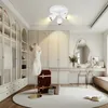 A bright, modern dressing room or walk-in closet with a ceiling light, wardrobe, vanity, and mannequin. Náhľad obrázku produktu