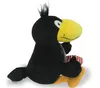 A plush toy of a black bird with a yellow beak sitting down. Produktbild-Vorschau