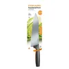 A Fiskars Functional Form chef's knife is displayed in its retail packaging. Podgląd zdjęcia produktu