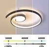 A modern LED ceiling light with a spiral design, shown in three different color temperatures: warm white (3000K), neutral white (4000K), and cool white (6000K). The image also displays brightness levels. Produktbild-Vorschau