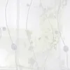 A sheer white curtain with a delicate embroidered pattern of wavy lines and circles. Produktbild-Vorschau