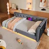 A modern bedroom with a gray upholstered daybed featuring LED lighting and a tablet. Produktbild-Vorschau