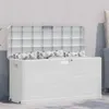 A white outdoor storage box with cushions on top, placed against a textured wall. Anteprima dell’immagine prodotto
