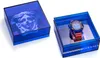 A Versace watch is displayed in its blue transparent packaging, with a separate box showing a Medusa head sculpture. Náhled obrázku produktu