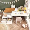 A child's bedroom with a bed, desk, and toys. Produktbild-Vorschau
