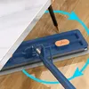 A blue mop with a gray cleaning pad is being used to clean a wooden floor under a table with a marble-patterned surface. Náhled obrázku produktu