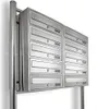 A set of stainless steel mailboxes mounted on a pole against a white background. Produktbild-Vorschau
