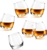 Six rocking whiskey glasses filled with amber liquid, arranged on a white background. Podgląd zdjęcia produktu
