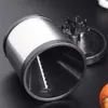 A close-up shot of a stainless steel vegetable spiralizer on a black surface. Produktbild-Vorschau