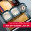 A drawer filled with food storage containers and dry goods like pasta and rice. Produktbild-Vorschau