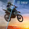 A motocross rider in mid-air against a sky and desert background, with marketing text and logos. Produktbild-Vorschau