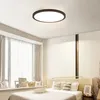 A bedroom with a bed, window, and ceiling light. Produktbild-Vorschau