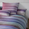 A close-up view of bedding with a striped pattern. Produktbild-Vorschau