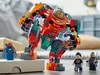 A LEGO set featuring a large robot and three minifigures, set on a table. Náhled obrázku produktu