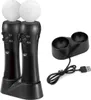 A black charging dock with two black controllers, each topped with a white sphere, and a black USB cable. Produktbild-Vorschau