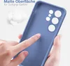 A hand is touching a blue phone case, highlighting its matte surface and soft grip. Produktbild-Vorschau