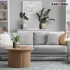 A living room scene with a sofa, coffee table, and plants. Anteprima dell’immagine prodotto