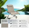 A lounge chair is placed by an infinity pool with a tropical background. Produktbild-Vorschau