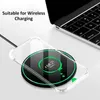 A clear phone case is placed on a wireless charging pad, which is connected to a laptop. Produktbild-Vorschau