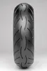 A close-up, front-facing studio shot of a motorcycle tire against a light gray background. Produktbild-Vorschau