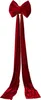 A large red velvet bow with two long streamers, hanging against a white background. Podgląd zdjęcia produktu