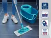 A person is using a mop and bucket on a tiled floor. Produktbild-Vorschau