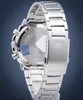 The back of a silver metal watch with a blue sticker on the case. Voir les images du produit