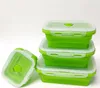 A stack of green silicone food storage containers with clear lids on a white background. Náhled obrázku produktu