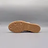 The underside of a single Adidas Samba OG shoe is shown against a plain gray background. Podgląd zdjęcia produktu