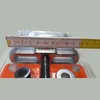 A close-up view of a tool with a measuring tape across it. Produktbild-Vorschau