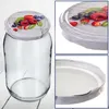A collage of images showing a glass jar with a decorative lid featuring berries, and close-ups of the lid and the jar's rim. Voir les images du produit