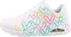 A side view of a white Skechers sneaker with a colorful heart pattern. Produktbild-Vorschau