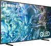 A Samsung QLED Smart TV is shown from a side angle, displaying a colorful abstract image on its screen. Produktbild-Vorschau