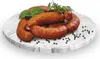 A pile of sausages on a marble plate with some herbs and peppercorns. Náhled obrázku produktu