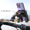 A smartphone holder attached to a bicycle handlebar, with icons indicating compatibility with scooters, bicycles, motorcycles, and electric bikes. Produktbild-Vorschau